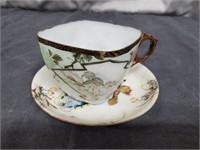 Handpainted Porcelain Tea Cup and Saucer