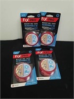 Four new packages of mounting tape