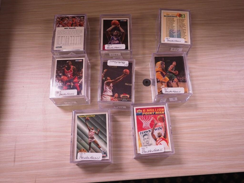 Eight clear plastic boxes of 1990s basketball