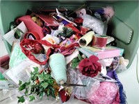 Craft supplies including artificial flowers,