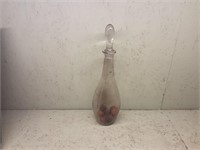 Tall glass Decanter  with a couple walnuts in