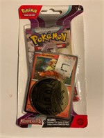 Sealed Pokémon card pack with token