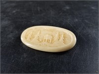 Ancient mammoth ivory pin showing an Alaskan st