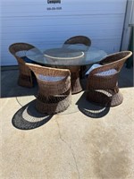 Wicker dining room table with glass top and 4
