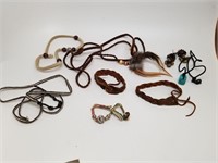 Assorted leather, woven, and beaded jewelry