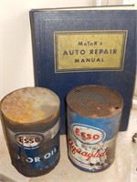 antique motor repair book and 2 cans