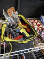 assorted tools including pruners pliers and more