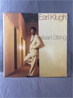An Earl Klugh "Heart String" Vinyl Record.  No