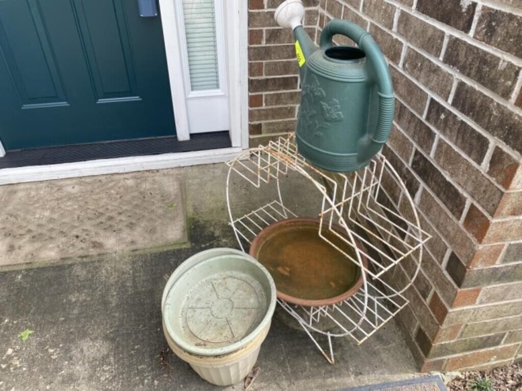 plant stand, pots, and watering can