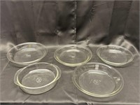 Five Pyrex baking pans