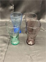 Four Coca-Cola glasses