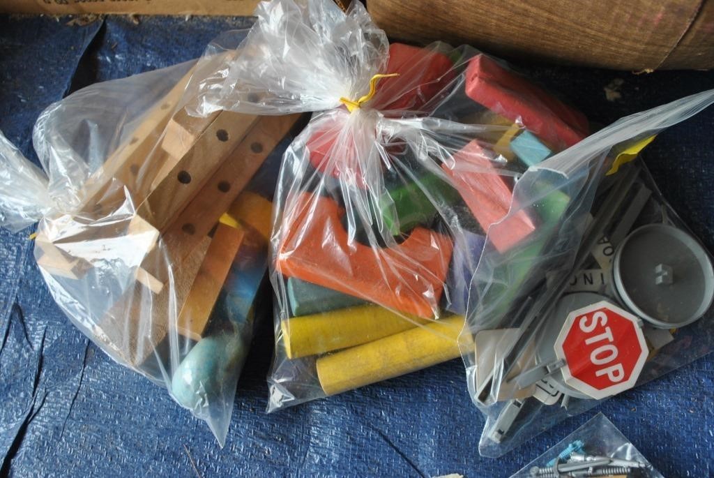 bags of Wooden blocks and traffic signs