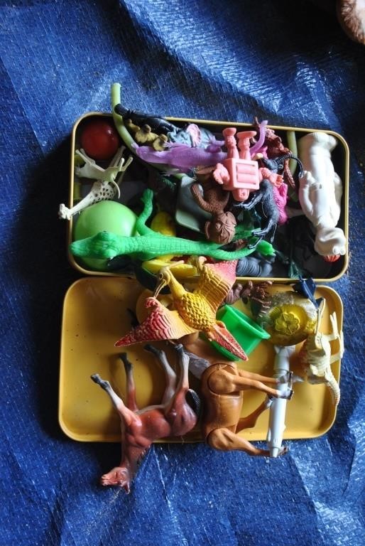 Tin box of plastic animals