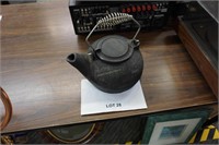 heavy cast iron kettle with spiral handle