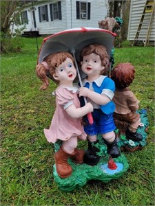 Lawn statues x2, swinging girl and umbrella couple