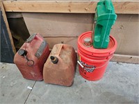 Two 5 Gal fuel cans One 5 gal bucket