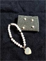 2 pair of pearl colored earrings and bracelet