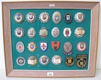 Spanish Police panel of twenty four cap badges