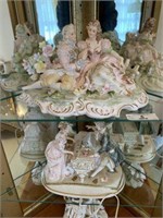 Two Lighted Figural Music Boxes