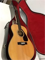 Yamaha SJ-180 guitar with case.