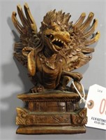 Oriental Griffen carving. Several wing tips
