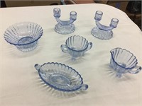 Blue antique glassware and candleholders chip in