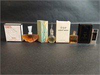 Four Small Sample Size Perfume Botles