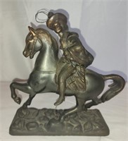 Metal man on horse statue