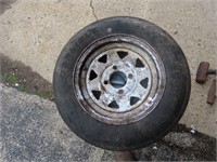 5.30-12 trailer tire on rim.  4 bolt pattern.