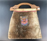Antique hand made seal skin bag, with Tlingit carv