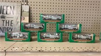 6 miniature Hess trucks