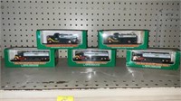 5 miniature Hess trucks