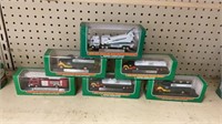 6 miniature Hess trucks