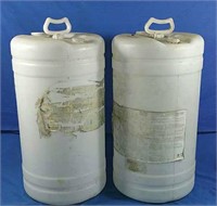 Two large empty plastic jugs - 26"H
