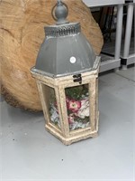 Lantern with glass and latch. Has pretty flowers