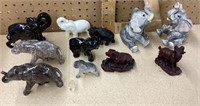 9 ceramic elephants and 2 resin animals
