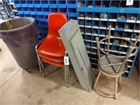 Three red fiberglass stacking chairs, 5 metal