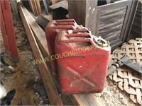 2 red metal blitz gas cans
