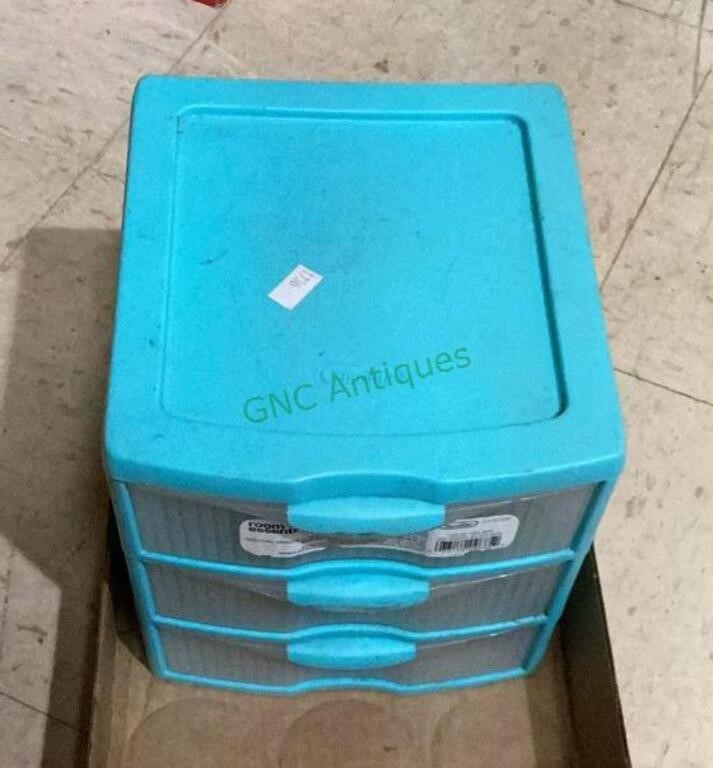 Three drawer small plastic container filled with