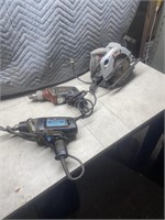 Pair of electric drills and a Skil saw running