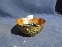 copper bowl with stones