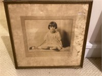 Framed antique photo portrait of little girl