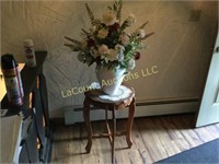 entry table with vase and floral arrangement
