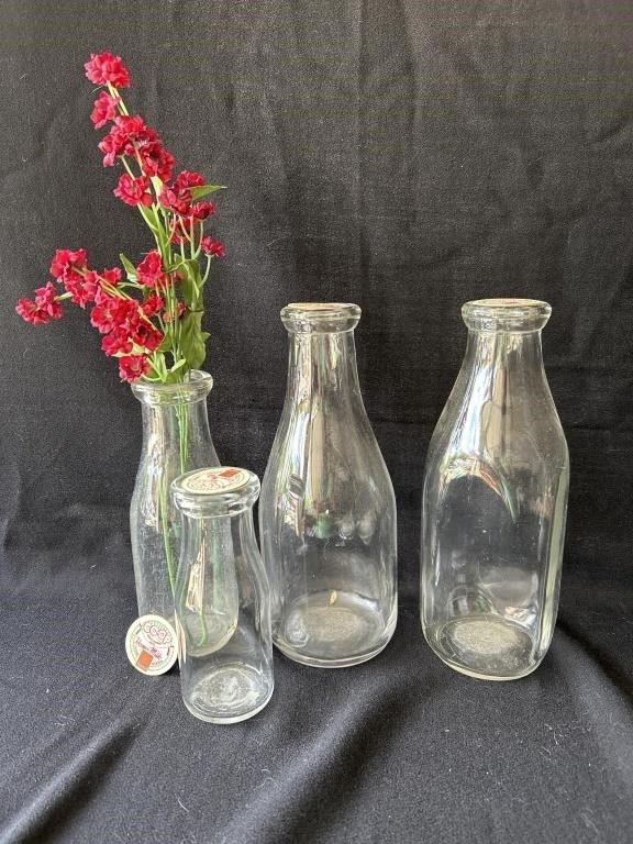 Vintage milk bottles with paper lids