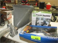 Flat w/shoeshine kit, propane regulator, misc