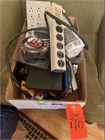 Box lot assorted power strip, plug ins, staplers