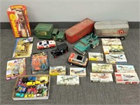 Group of toys including airplane models in boxes,