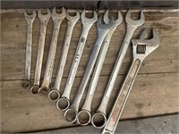 Group of 11 oversized combination wrenches.