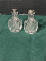 Antique cut glass S & P's. Sterling silver tops,