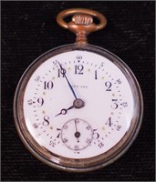A woman's open face pocket watch marked